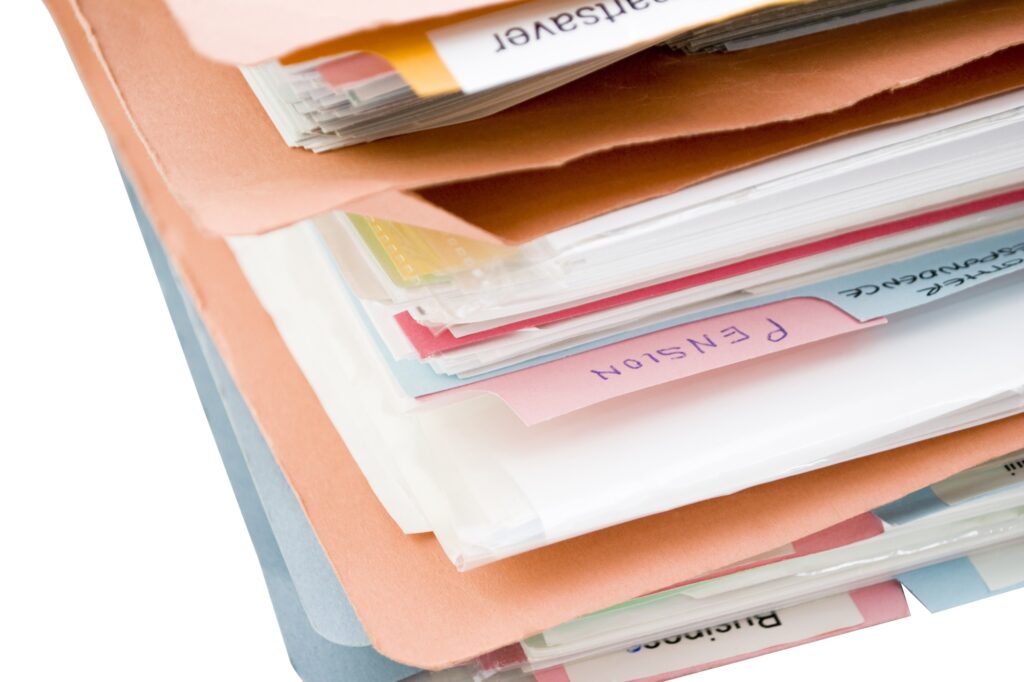 Stack of folders containing personal documents